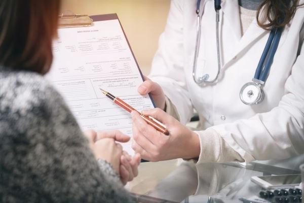 doctor helping patient